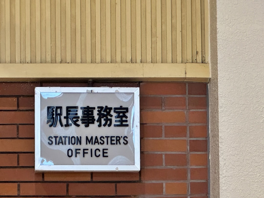 hotel service dog. A sign on the side of a building that says station master' s office
