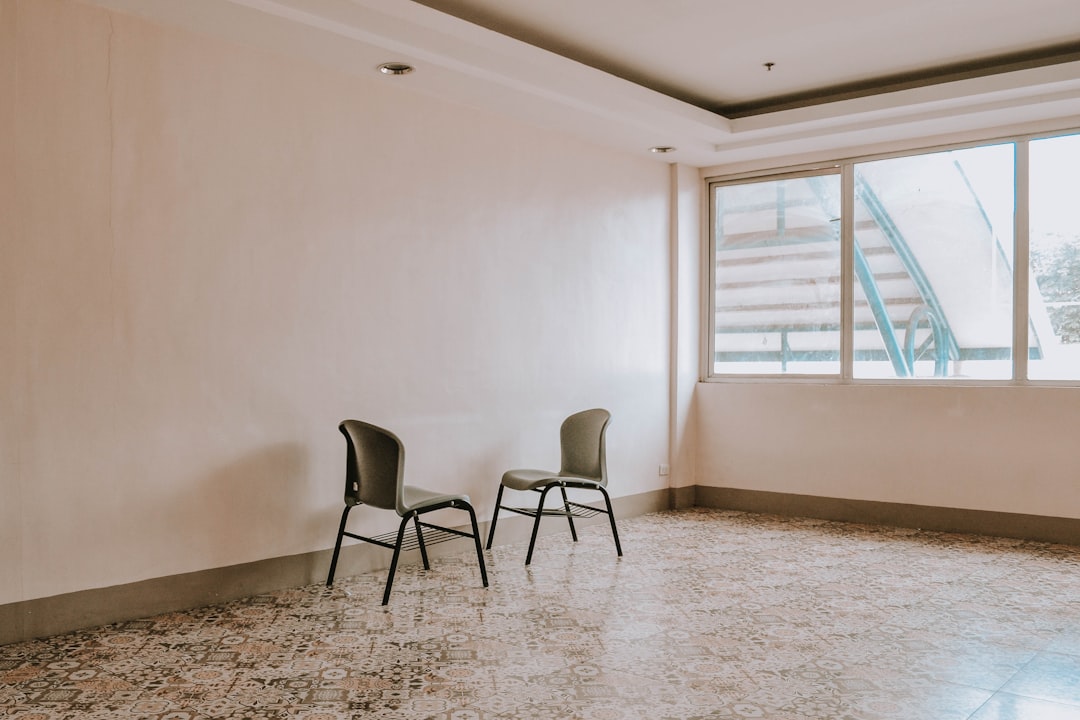 support animal damage. Black metal framed gray padded chairs