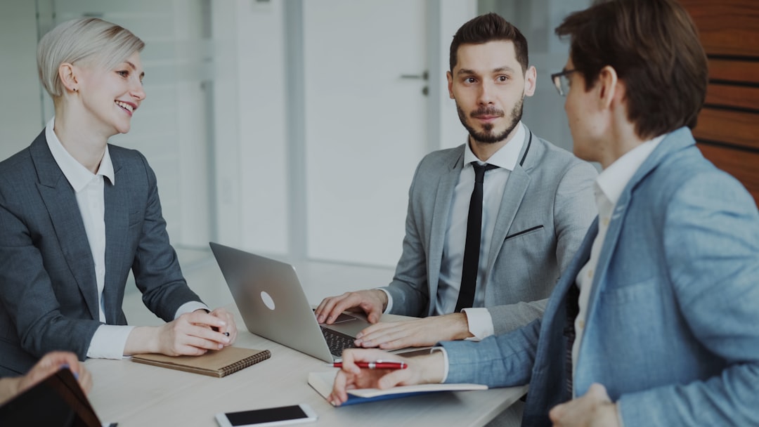 legally deny support animals. Business professionals in a meeting around a table.