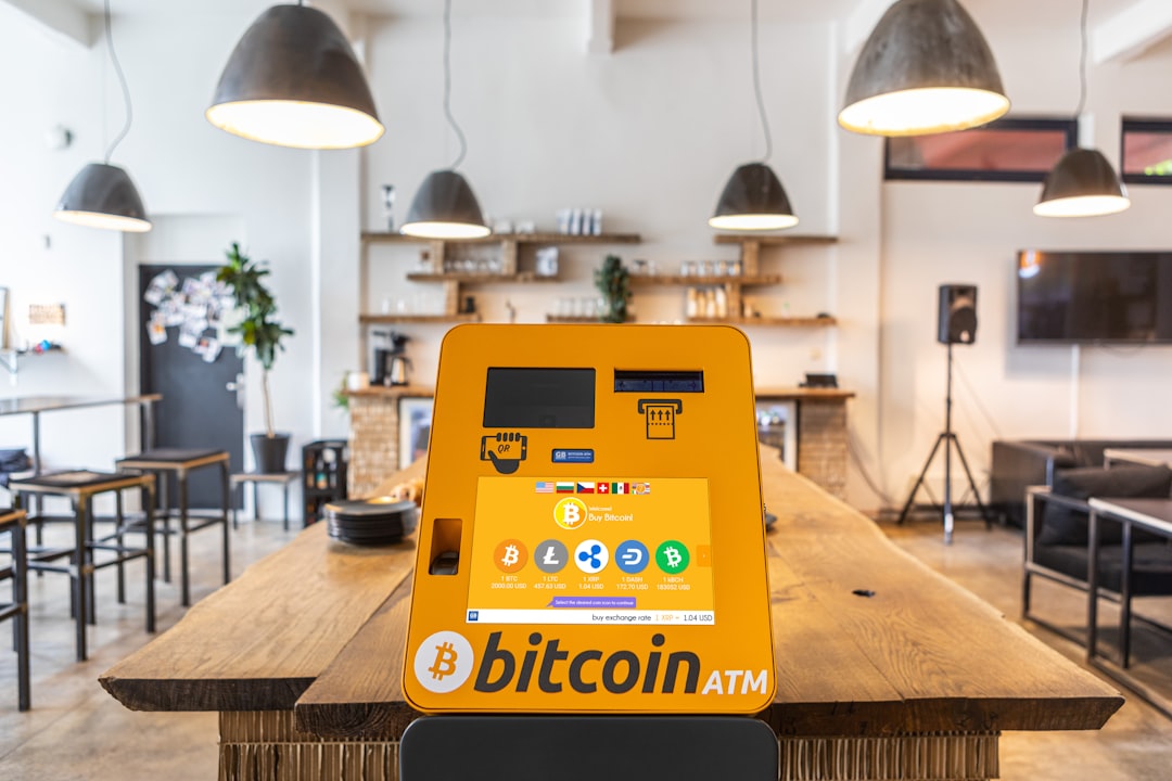 QR code verification. A bitcoin atm sitting on top of a wooden table