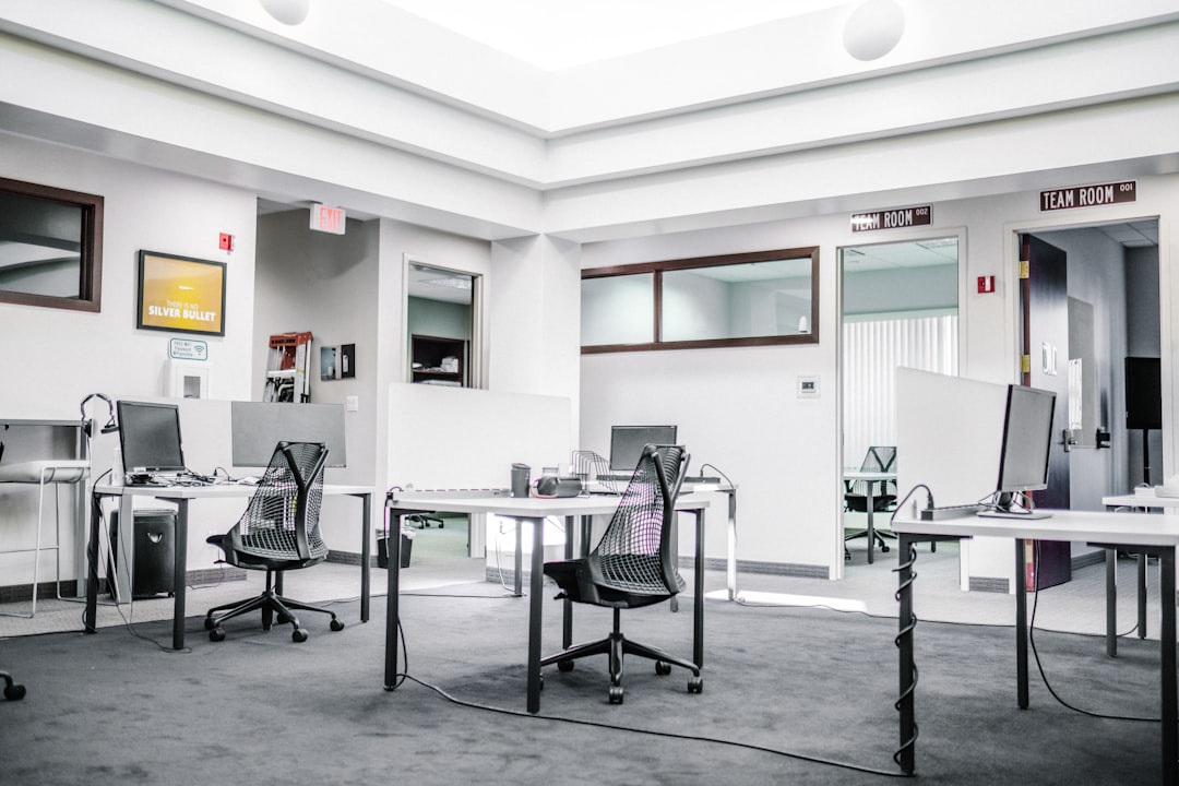 HOA support animal. Black metal chairs and table near white wall