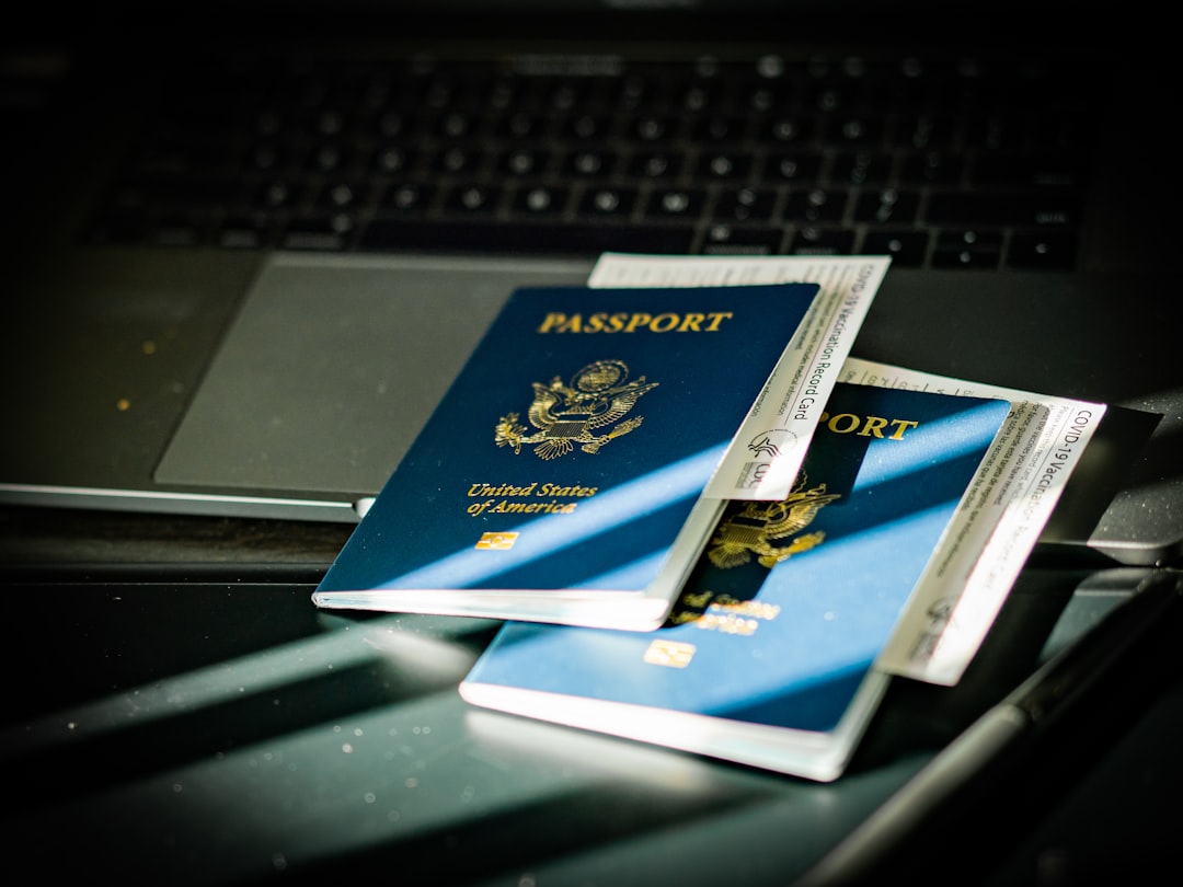online registries vs clinical documentation — a passport sitting on top of a computer keyboard