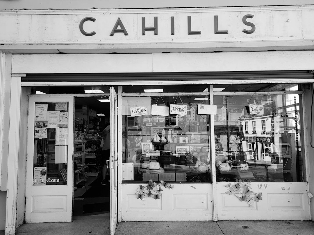 HOA support animal — The storefront of Cahills with a glass window displaying various items and signs