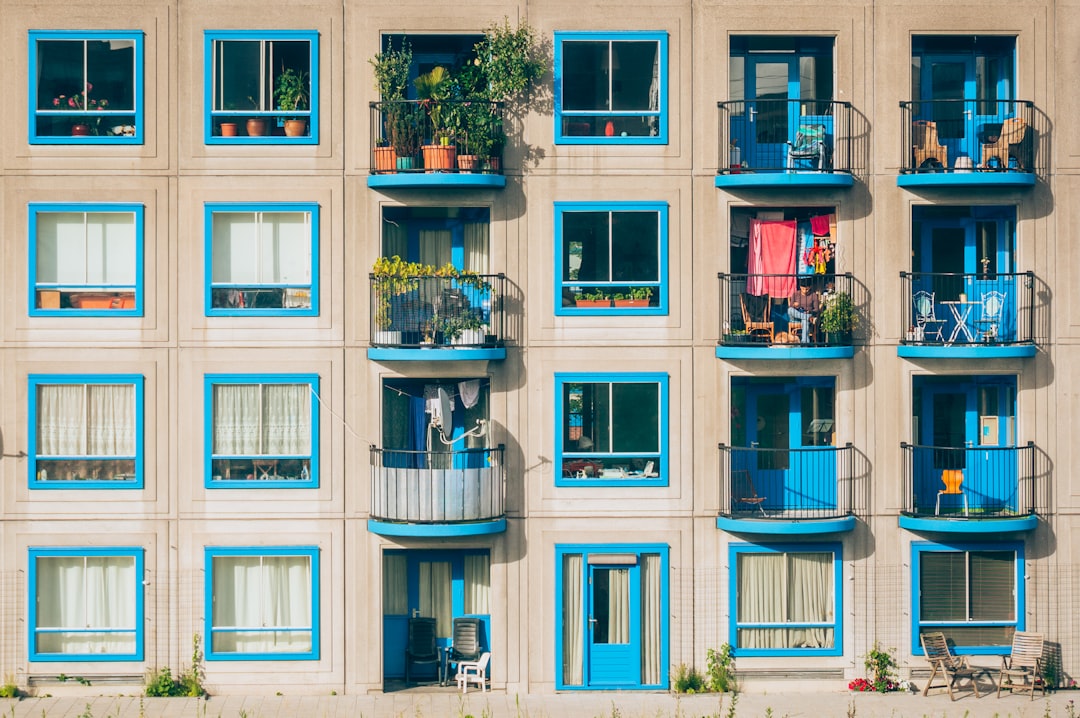 reasonable accommodation requests — white and blue concrete 4-storey building